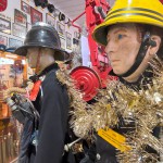 1970s Firemans Uniform With Yellow Cork Helmet Nomex Fire Tunic And The Iconic Yellow Waterproof Overtrousers mannequin-man performming as a Museum Dummy: The Essex Fire Museum added some christmas decorations to the historic firefighter uniform dispolay for Essex Fire Museum on 17/12/2023