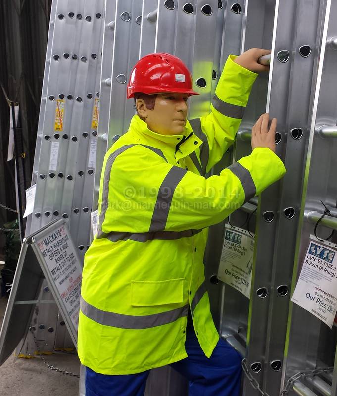 Dickie the mannequin climbing a ladder wearing Dickies royal blue redhawk coveralls and a yellow hi-vis jacket - Dickie the mannequin climbing a ladder Dickie the mannequin climbing a ladder wearing Dickies royal blue redhawk coveralls and a yellow hi-vis jacket - Dickie the mannequin climbing a ladder