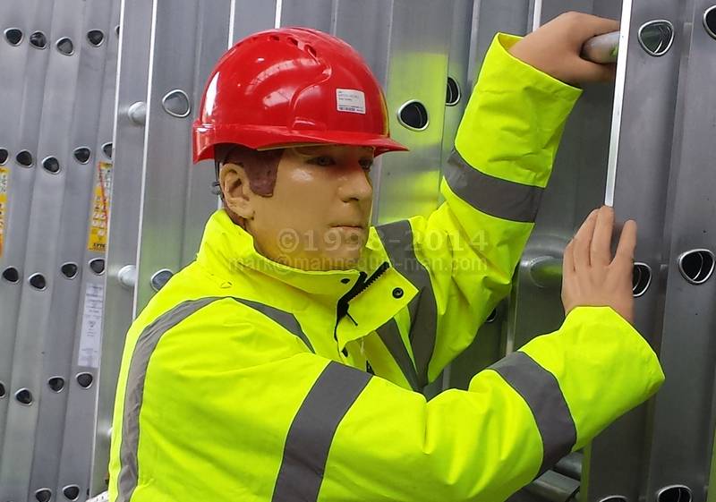 Dickie the mannequin climbing a ladder wearing a Dickies redhawk coveralls and a hi-vis jacket - Dickie the mannequin climbing a ladder Dickie the mannequin climbing a ladder wearing a Dickies redhawk coveralls and a hi-vis jacket - Dickie the mannequin climbing a ladder