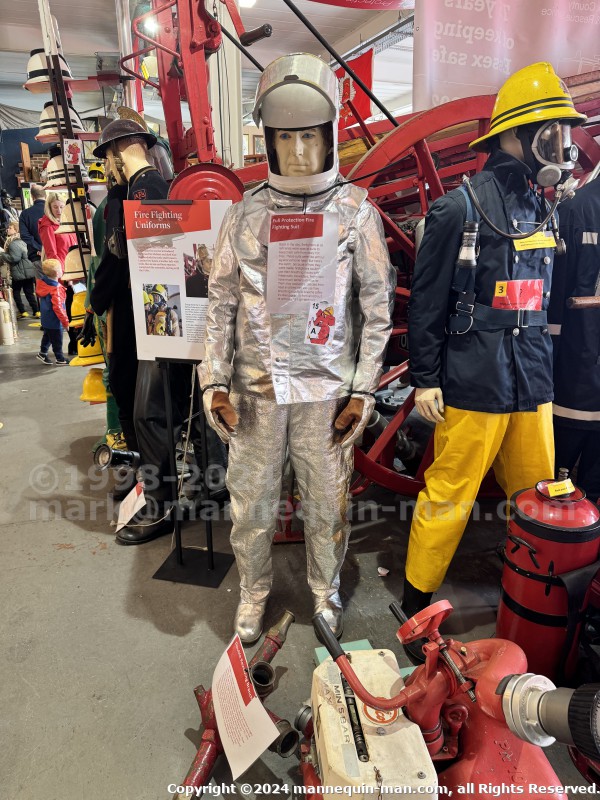Mannequin demonstrating hazard protection clothing. This mannequin is wearing a Heat Resistant Aluminized Foil Refinery Proximity Suit. - Essex Fire Museum Living Mannequin Wearing A Heat Resistant Aluminized Foil Refinery Proximity Suit Mannequin demonstrating hazard protection clothing. This mannequin is wearing a Heat Resistant Aluminized Foil Refinery Proximity Suit. - Essex Fire Museum Living Mannequin Wearing A Heat Resistant Aluminized Foil Refinery Proximity Suit