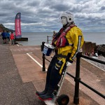Human Living Mannequin Collects Donations For The Sidmouth Charity Lifeboat As Sid The Mannequin During August Bank Holiday Weekend mannequin-man performming as a Living Mannequin: Became Sid again for the Sidmouth lifeboat collecting donations over two days of the bank holiday weekend for Sidmouth Lifeboat on 26/08/2023