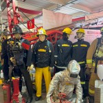 Iconic 1970s Firemans Uniform With Yellow Yellow Waterproof Overtrousers And Yellow Cork Helmet With Blue Nomex Fire Tunic mannequin-man performming as a Museum Dummy: Mannequin wearing a 1976 Nomex jacket, yellow cork helmet and classic yellow PVC leggings. for Essex Fire Museum on 26/11/2023