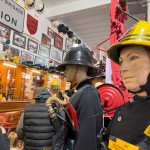 Iconic 1970s Firemans Uniform With Yellow Yellow Waterproof Overtrousers And Yellow Cork Helmet With Blue Nomex Fire Tunic mannequin-man performming as a Museum Dummy: Mannequin wearing a 1976 Nomex jacket, yellow cork helmet and classic yellow PVC leggings. for Essex Fire Museum on 26/11/2023