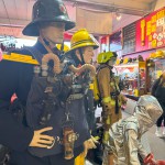 Iconic 1970s Firemans Uniform With Yellow Yellow Waterproof Overtrousers And Yellow Cork Helmet With Blue Nomex Fire Tunic mannequin-man performming as a Museum Dummy: Mannequin wearing a 1976 Nomex jacket, yellow cork helmet and classic yellow PVC leggings. for Essex Fire Museum on 26/11/2023