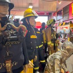 Iconic 1970s Firemans Uniform With Yellow Yellow Waterproof Overtrousers And Yellow Cork Helmet With Blue Nomex Fire Tunic mannequin-man performming as a Museum Dummy: Mannequin wearing a 1976 Nomex jacket, yellow cork helmet and classic yellow PVC leggings. for Essex Fire Museum on 26/11/2023