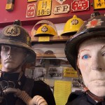 Living Mannequin Wearing 1950s Firefighter Uniform Black Helmet Yellow Leggings Essex Fire Museum mannequin-man performming as a Museum Dummy: Mannequin man wearing 1950-1960 firefighter uniform and breathing apparatus amusing the visitors for Essex Fire Museum on 26/05/2024
