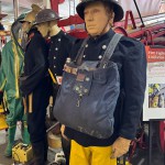 Mannequin man wearing 1950-1960 firefighter uniform and breathing apparatus amusing the visitors
