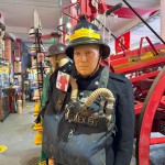 Mannequin Wearing 1950s Firefighter Uniform Mark 5 Proto Breathing Apparatus Yellow Pvc Leggings Black Helmet Essex Fire Museum mannequin-man performming as a Museum Dummy: Mannequin man wearing 1950-1960 firefighter uniform and breathing apparatus amusing the visitors for Essex Fire Museum on 25/02/2024