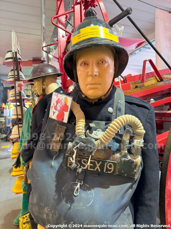 Mannequin man wearing 1950-1960 firefighter uniform and breathing apparatus amusing the visitors - Mannequin Wearing 1950s Firefighter Uniform Mark 5 Proto Breathing Apparatus Yellow Pvc Leggings Black Helmet Essex Fire Museum Mannequin man wearing 1950-1960 firefighter uniform and breathing apparatus amusing the visitors - Mannequin Wearing 1950s Firefighter Uniform Mark 5 Proto Breathing Apparatus Yellow Pvc Leggings Black Helmet Essex Fire Museum