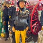 Mannequin Wearing 1950s Firefighter Uniform Mark 5 Proto Breathing Apparatus Yellow Pvc Leggings Black Helmet Essex Fire Museum mannequin-man performming as a Museum Dummy: Mannequin man wearing 1950-1960 firefighter uniform and breathing apparatus amusing the visitors for Essex Fire Museum on 25/02/2024