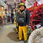 Mannequin Wearing 1950s Firefighter Uniform Mark 5 Proto Breathing Apparatus Yellow Pvc Leggings Black Helmet Essex Fire Museum mannequin-man performming as a Museum Dummy: Mannequin man wearing 1950-1960 firefighter uniform and breathing apparatus amusing the visitors for Essex Fire Museum on 25/02/2024