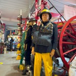 Mannequin Wearing 1950s Firefighter Uniform Mark 5 Proto Breathing Apparatus Yellow Pvc Leggings Black Helmet Essex Fire Museum mannequin-man performming as a Museum Dummy: Mannequin man wearing 1950-1960 firefighter uniform and breathing apparatus amusing the visitors for Essex Fire Museum on 25/02/2024