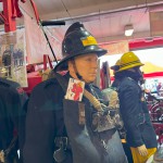 Mannequin Wearing 1950s Firefighter Uniform Mark 5 Proto Breathing Apparatus Yellow Pvc Leggings Black Helmet Essex Fire Museum mannequin-man performming as a Museum Dummy: Mannequin man wearing 1950-1960 firefighter uniform and breathing apparatus amusing the visitors for Essex Fire Museum on 25/02/2024