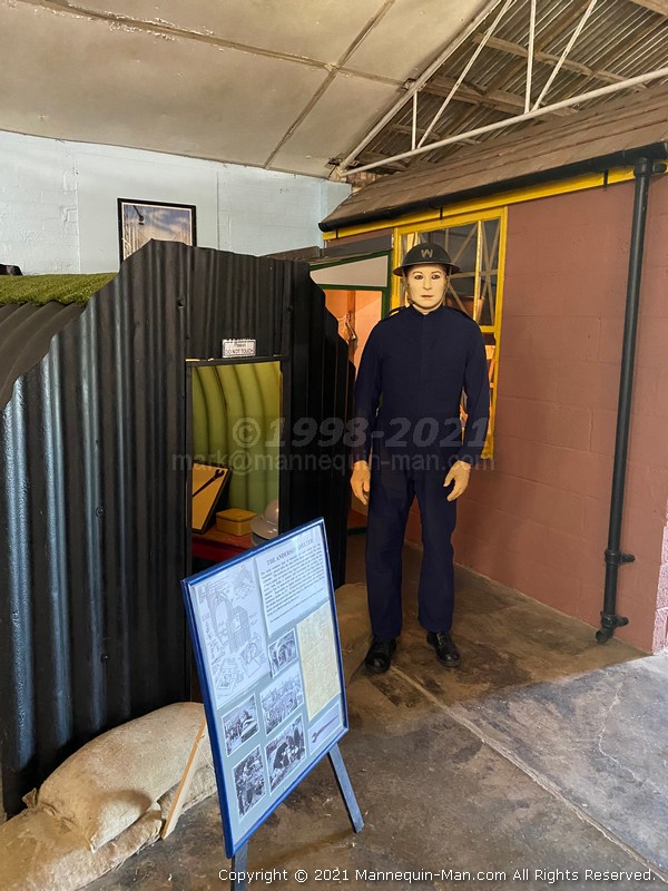 Mannequin man standing by an Anderson shelter - WW2 Civil Defence Mannequin at Thorpe Camp Visitor Centre Mannequin man standing by an Anderson shelter - WW2 Civil Defence Mannequin at Thorpe Camp Visitor Centre